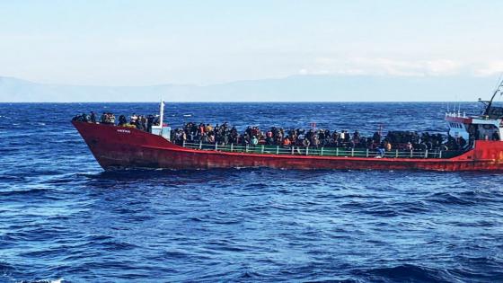 FILE PHOTO: A cargo ship carries migrants during a rescue operation, as it sails off the island of Crete, Greece, October 29, 2021. Hellenic Coast Guard/Handout via REUTERS ATTENTION EDITORS - THIS IMAGE WAS PROVIDED BY A THIRD PARTY./File Photo